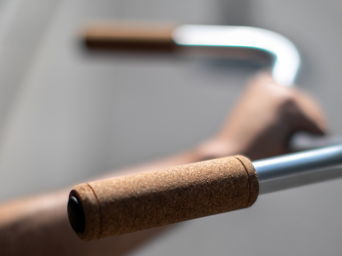 La Mad 1919 Cork Grips — pair shown on a silver handlebar, natural cork texture and closed end caps visible, neutral grey background