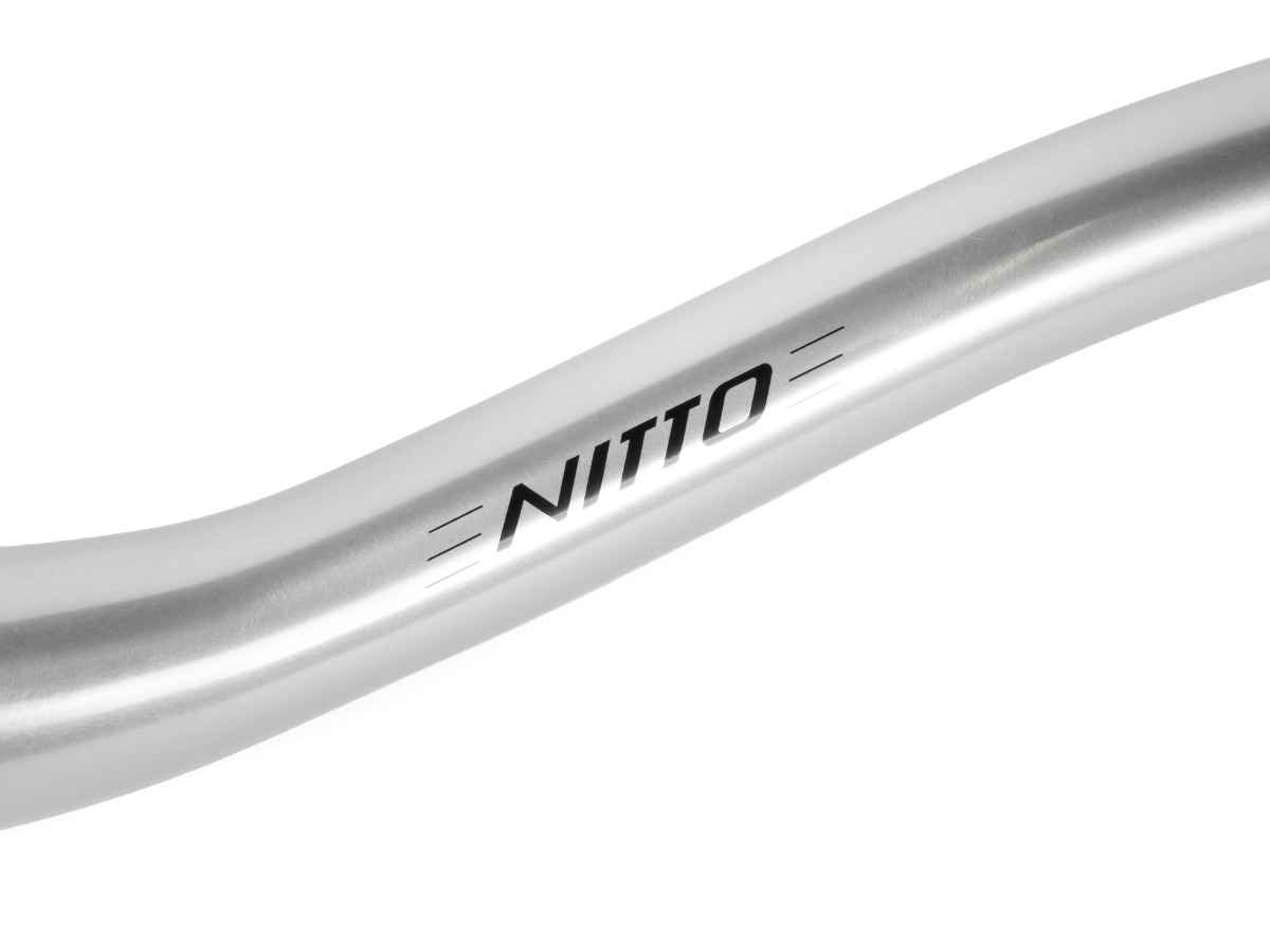 Close-up of the engraved Nitto logo on the Sync XL silver handlebar