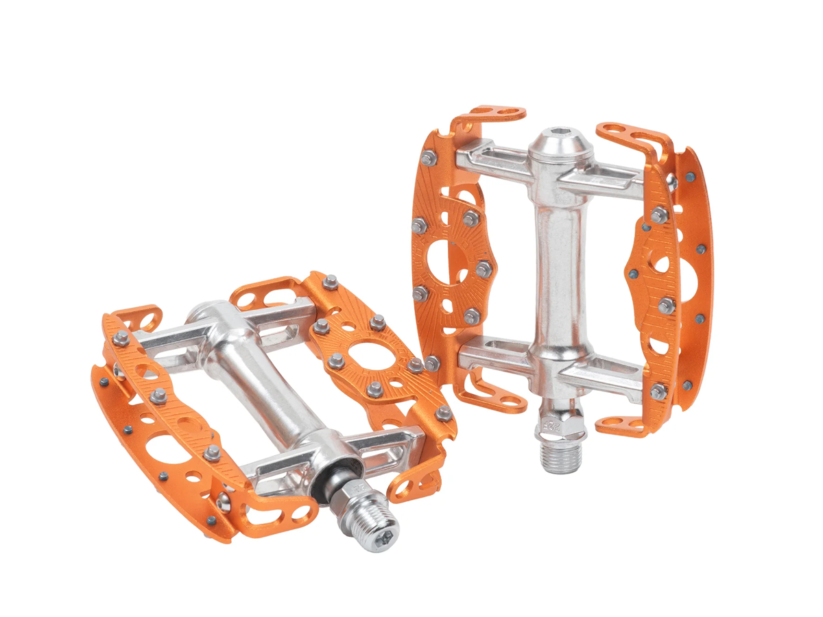 SimWorks Taquito Pedals in Sunrise orange — pair on white background showing the compact platform, open aluminum cage, replaceable grip studs and CrMo axle with cup-and-cone bearing